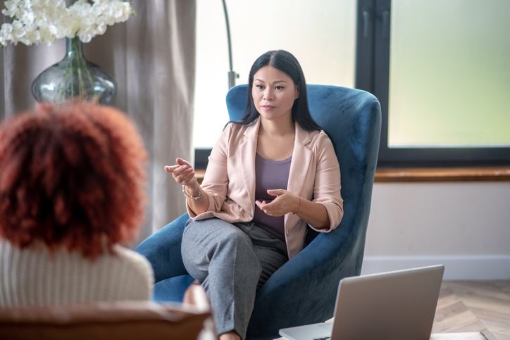 female psychologist talking to client