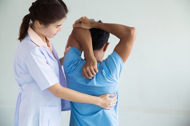 female physiotherapist with patient